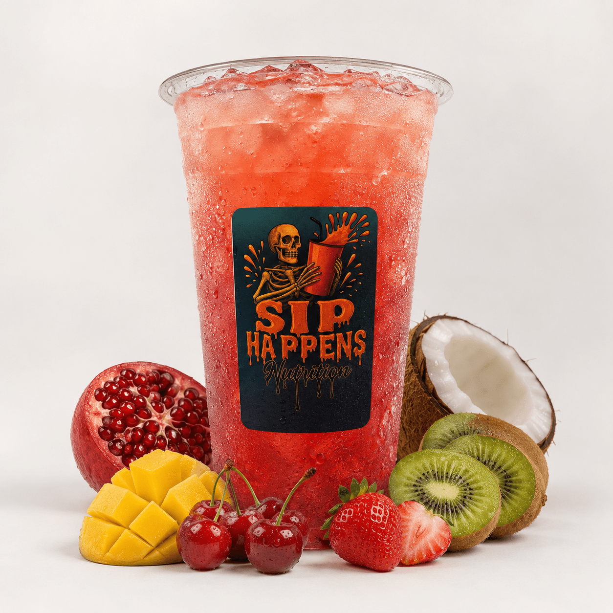 Sip Happens Nutrition iced fruit drink surrounded by pomegranate, mango, cherries, strawberries, kiwi, and coconut