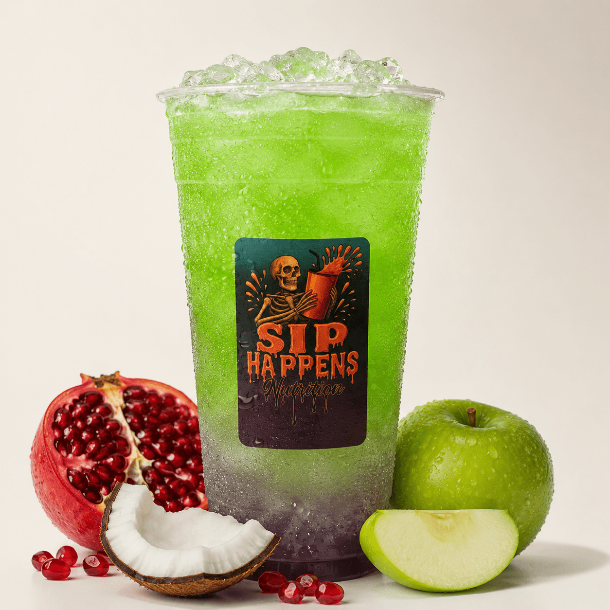 Sip Happens Nutrition iced drink with green-to-purple gradient, surrounded by pomegranate, coconut, and green apple