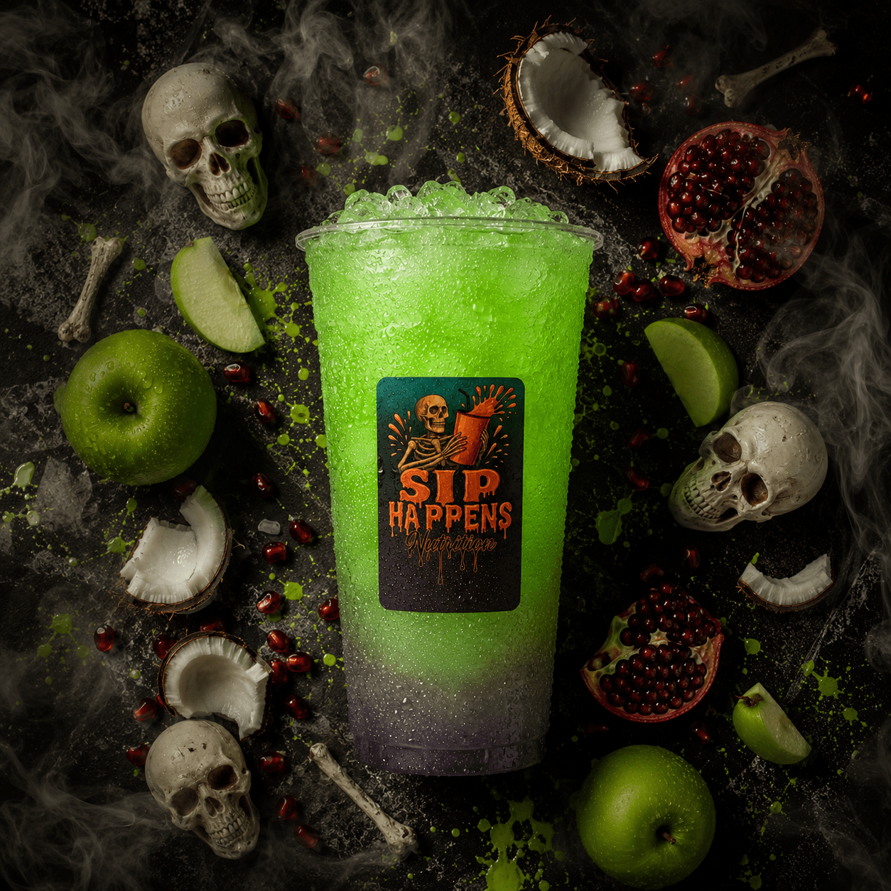 Sip Happens Nutrition Halloween-themed green drink surrounded by skulls, green apples, pomegranates, and coconuts on a dark surface with dry ice smoke