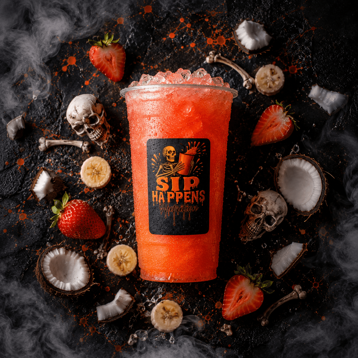 Sip Happens Nutrition iced drink in a branded cup surrounded by strawberries, coconut, and banana slices on a dark Halloween-themed surface