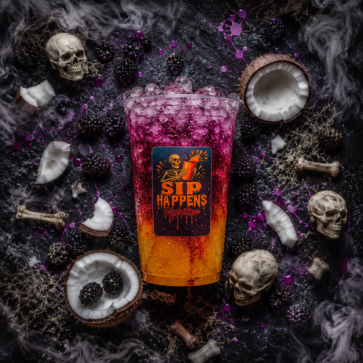 Sip Happens Nutrition Halloween-themed layered drink with blackberry and coconut, surrounded by skulls, bones, and dry ice smoke