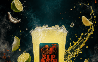 Sip Happens Nutrition iced yellow drink with lime and coconut pieces, surrounded by splashing liquid and dramatic dripping red backdrop